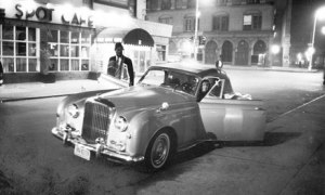 Thelonious Monk and Baroness Nica de Koenigswarter get into her Bebop Bentley outside the Five Spot cafe, New York, 1964